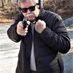 bob Campbell shooting a pistol one handed