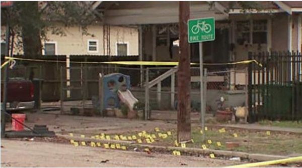 Crime scene with dozens of evidence markers in the yard