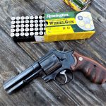 Smith and Wesson L Frame revolver with a box of Remington ammunition