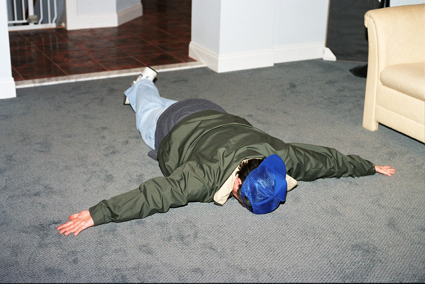 The final position has the assailant face down, looking away from you, arms spread with palms upward, and feet crossed.