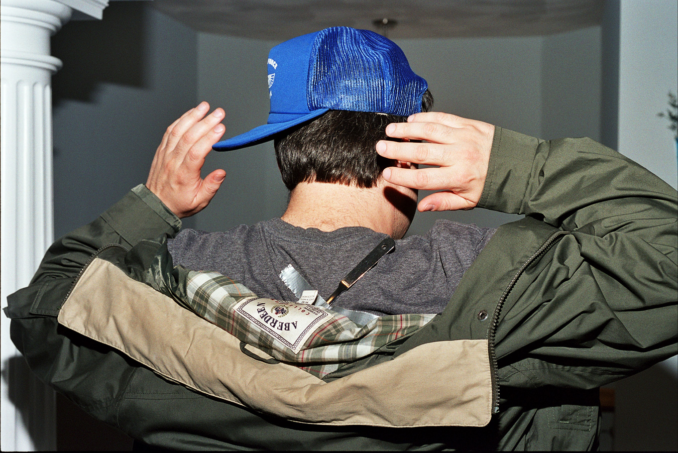 Man with a knife taped to his back