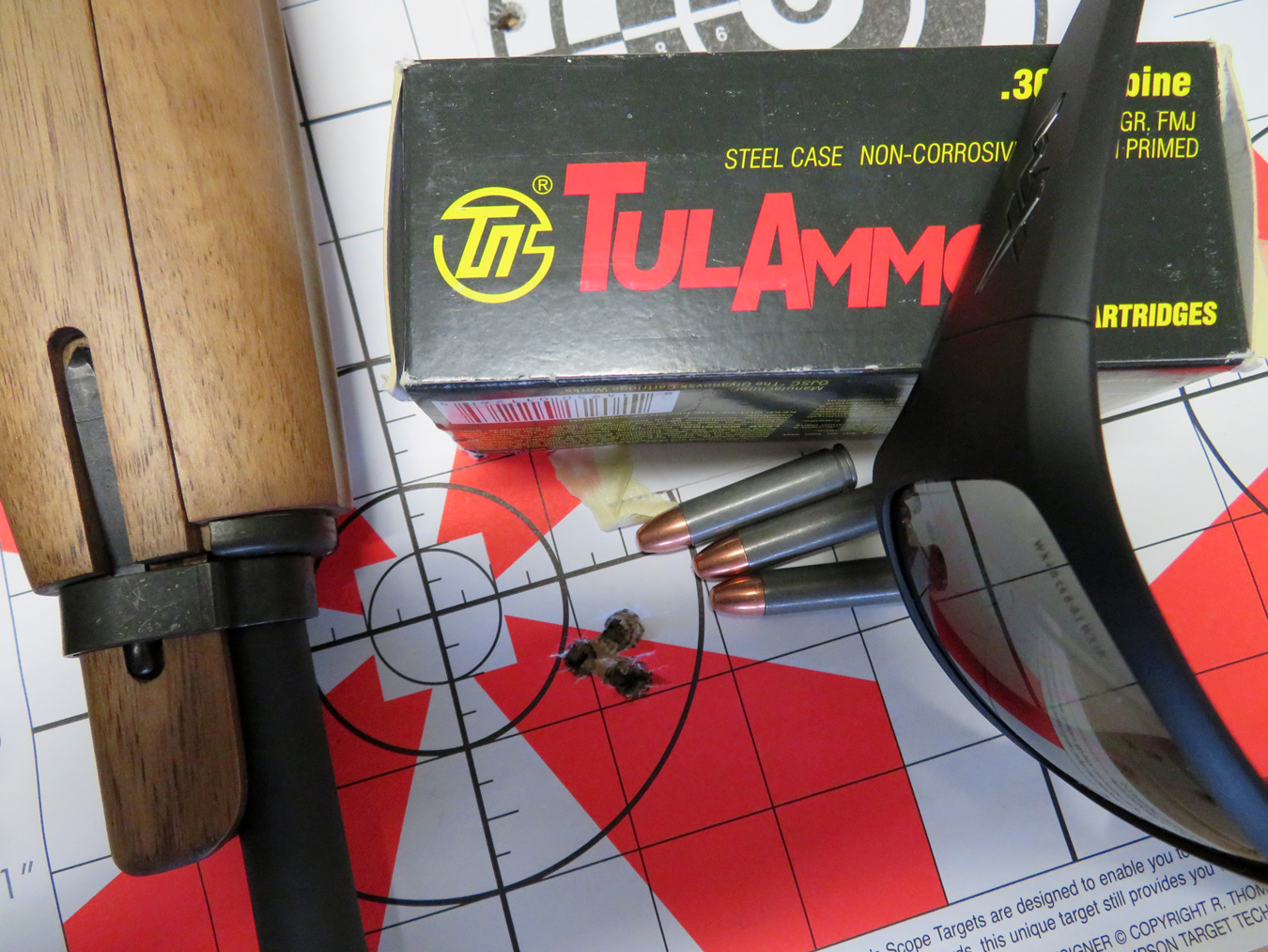M1 carbine, on a a target with a box of TulAmmo
