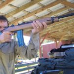 Robert Sadowski shooting a M1 Carbine rifle at an outdoor shooting range