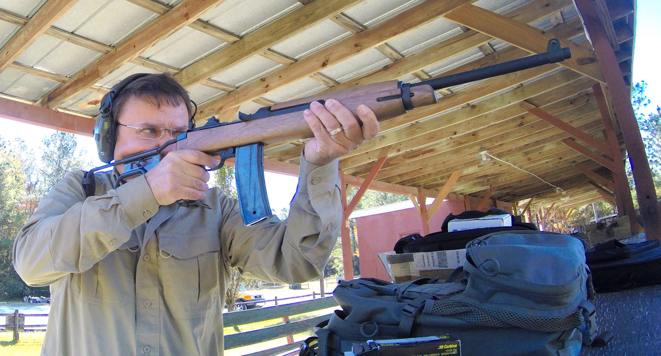 Robert Sadowski shooting a M1 Carbine rifle at an outdoor shooting range