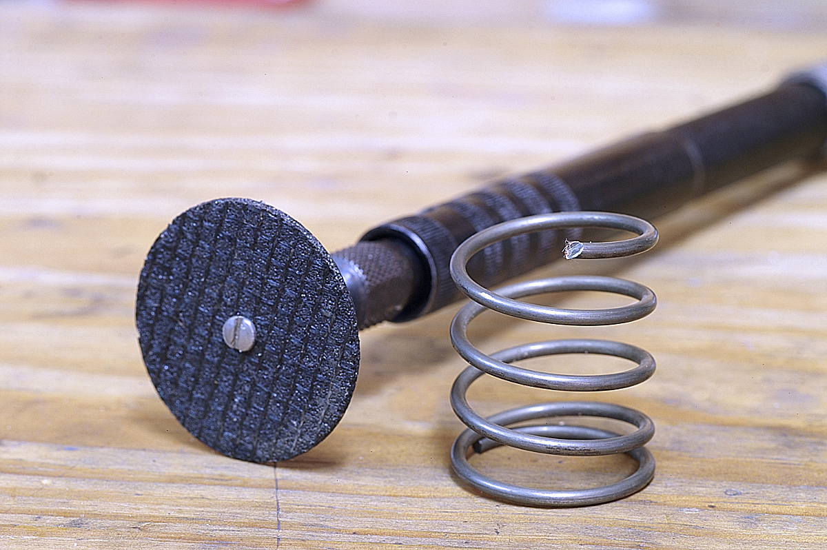 Cutting wheel for a Dremel tool and cut spring