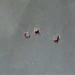 Four-shot group in a paper target