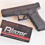 Blazer 9mm ammunition box with GLock 19 pistol