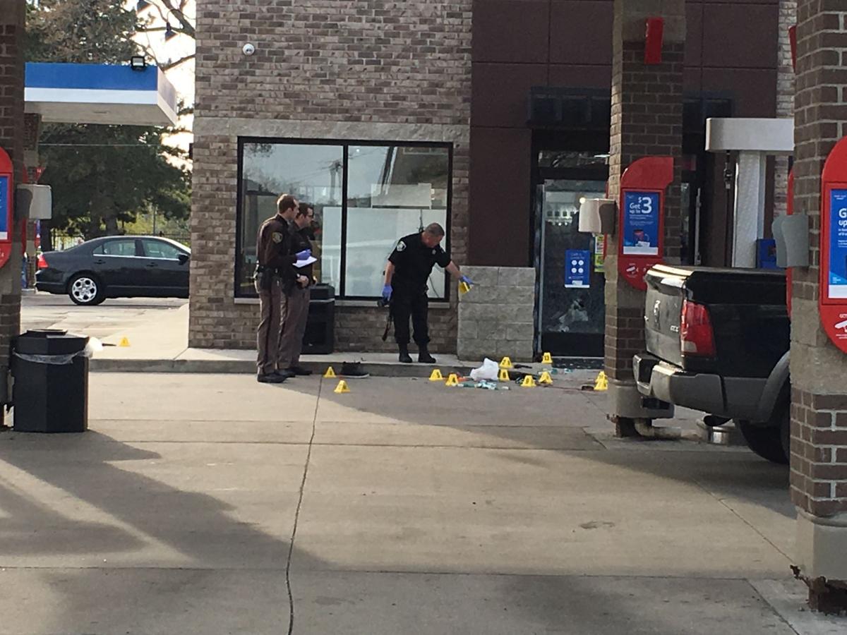 Evidence markers littering the scene of a shooting
