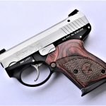 Bond Arms Bullpup pistol with wood grips left profile