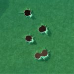 group on a green silhouette target