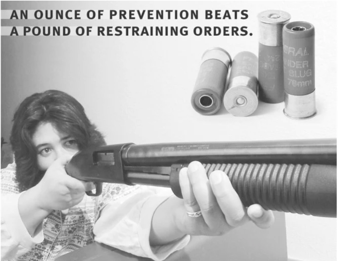 Woman pointing a shotgun for self-defense