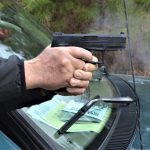 Bob Campbell shooting the taurus TX22 pistol with a two-handed grip