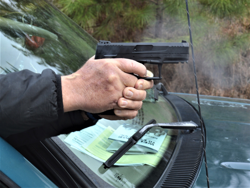 Bob Campbell shooting the Taurus TX22 pistol with a two-handed grip