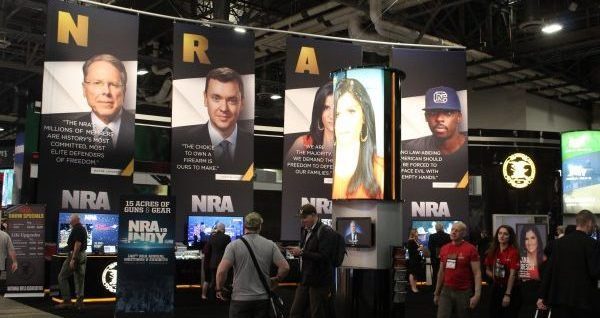 NRA Convention center banners of NRA TV hosts speaking against gun control lobby