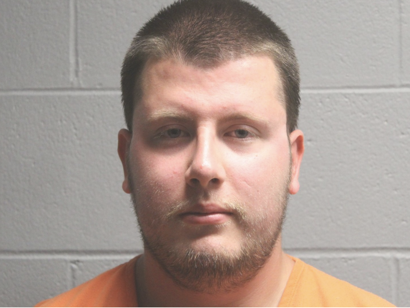 22-year old man in orange jail suit