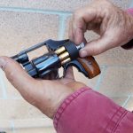Using a speed loader to load a revolver