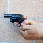 Smith and Wesson Centennial revolver held with a two handed grip