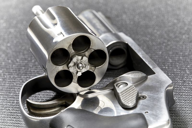 Revolver with open cylinder ready for armed good guys
