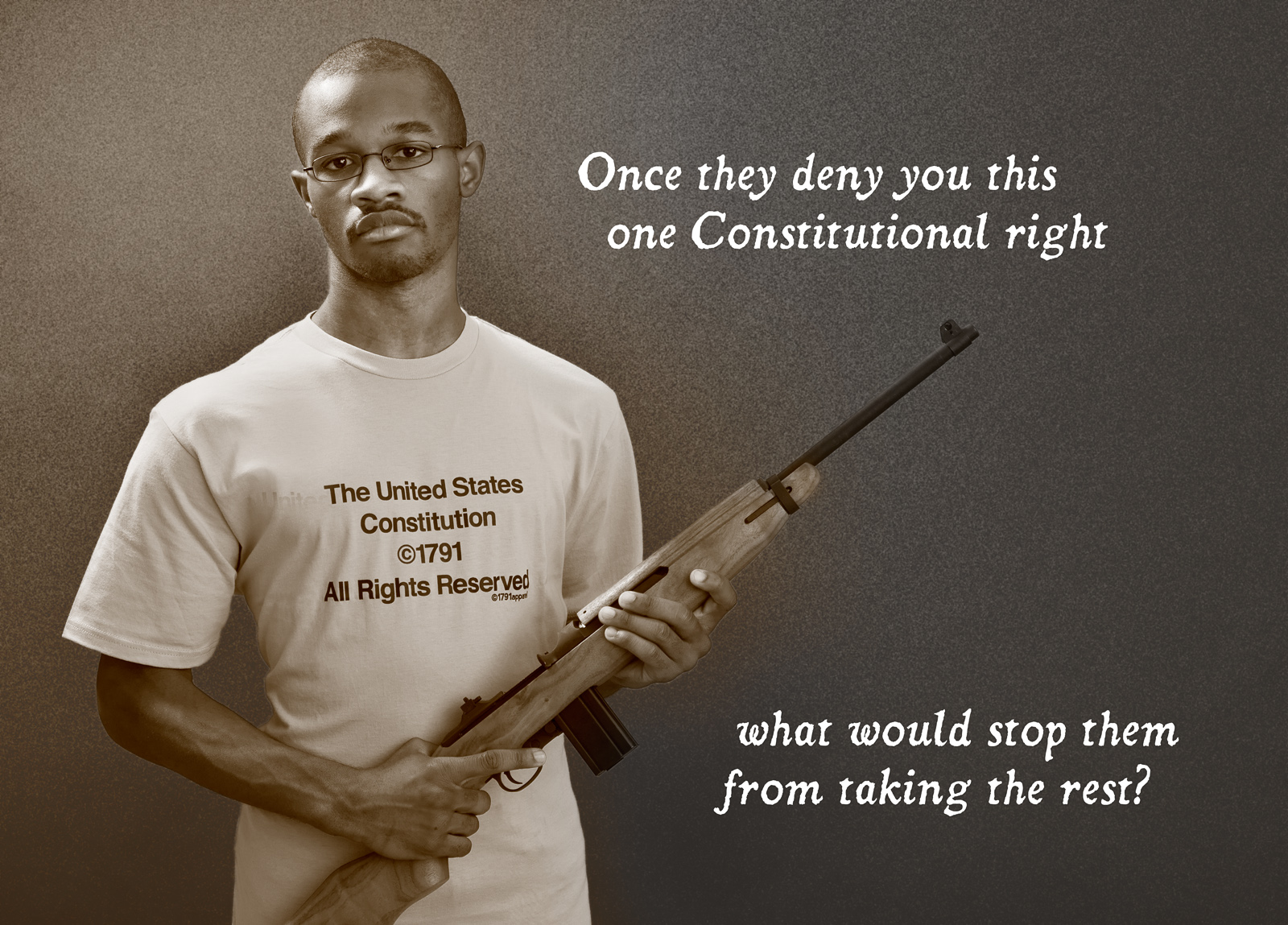 Message against gun confiscation on a t-shirt with a man holding a rifle