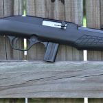Rossi RS22 rifle on a fence post right profile
