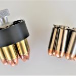 Revolver speed loader versus a loaded moon clip, side view