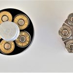 Revolver speed loader versus a loaded moon clip, top view