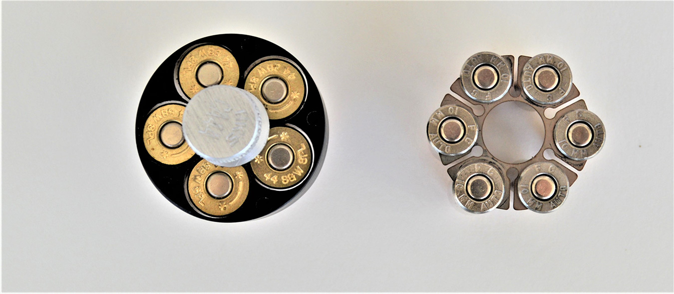 Revolver speed loader versus a loaded moon clip, top view