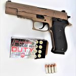 SIG Sauer Emperor Scorpion pistol left profile with Hornady Critical Duty ammunition box