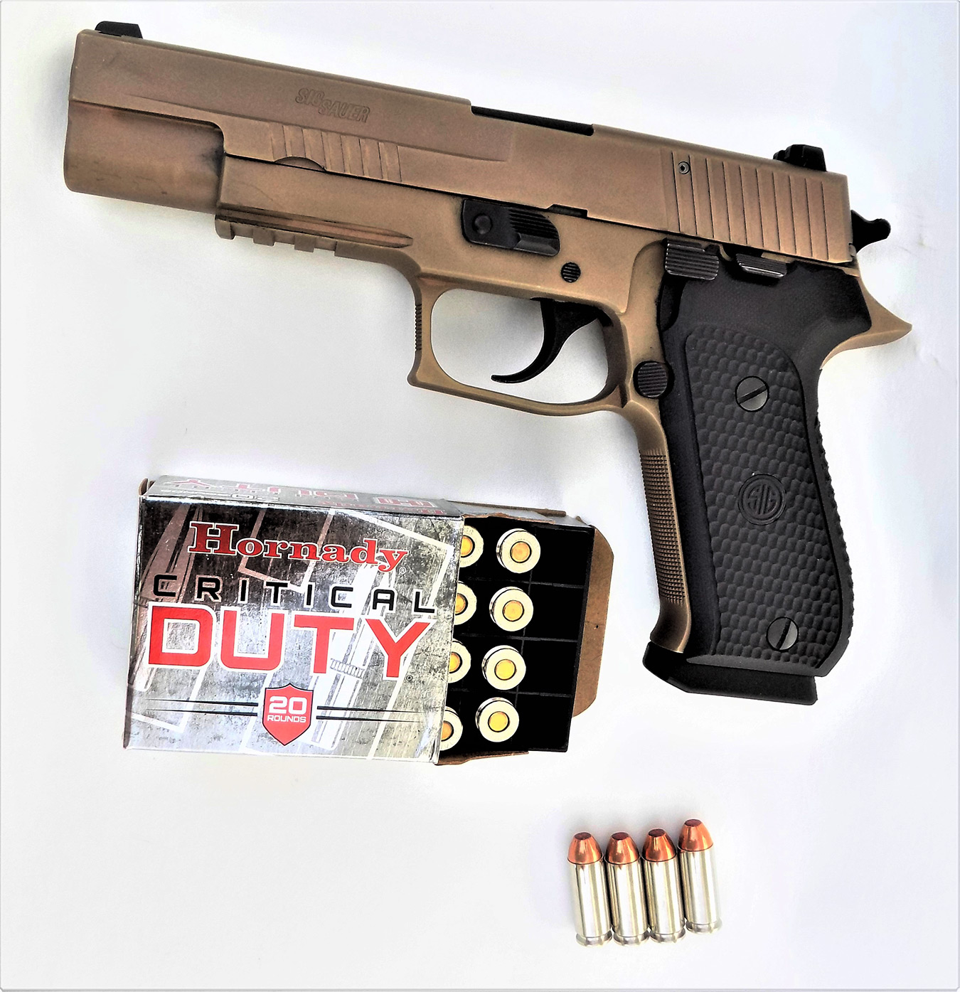 SIG Sauer Emperor Scorpion pistol left profile with Hornady Critical Duty ammunition box