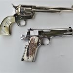 Old Colt revolver and Colt 1911 pistol