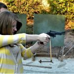 Young woman shooting the Smith and Wesson Combat Magnum revolver