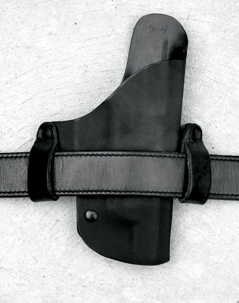 Straight cant leather holster on a gun belt