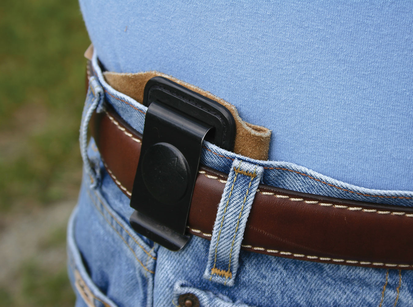 HOlster without reinforcements showing how it collapses under the pressure of a belt