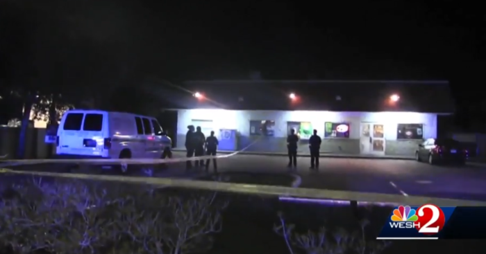Crime scene with police investigating after armed good guys saved the day