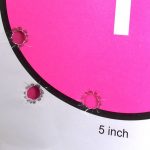 Bullet holes in a pink circle target