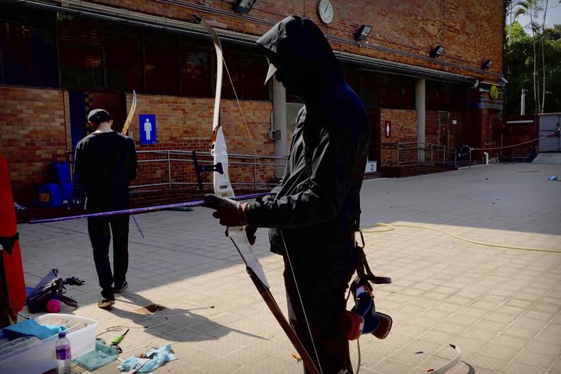 masked archer protesting in Hong Kong