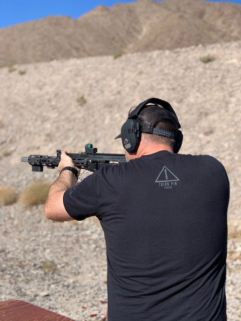 man shooting a Dissident Arms AK-47 at Red Oktober in Las Vegas Nevada