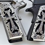 Engraved silver side plate grips for the 1911 pistol closeup