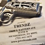 1911 pistol with Silver Grips on a cleaning cloth marked with Trendz Jewlers
