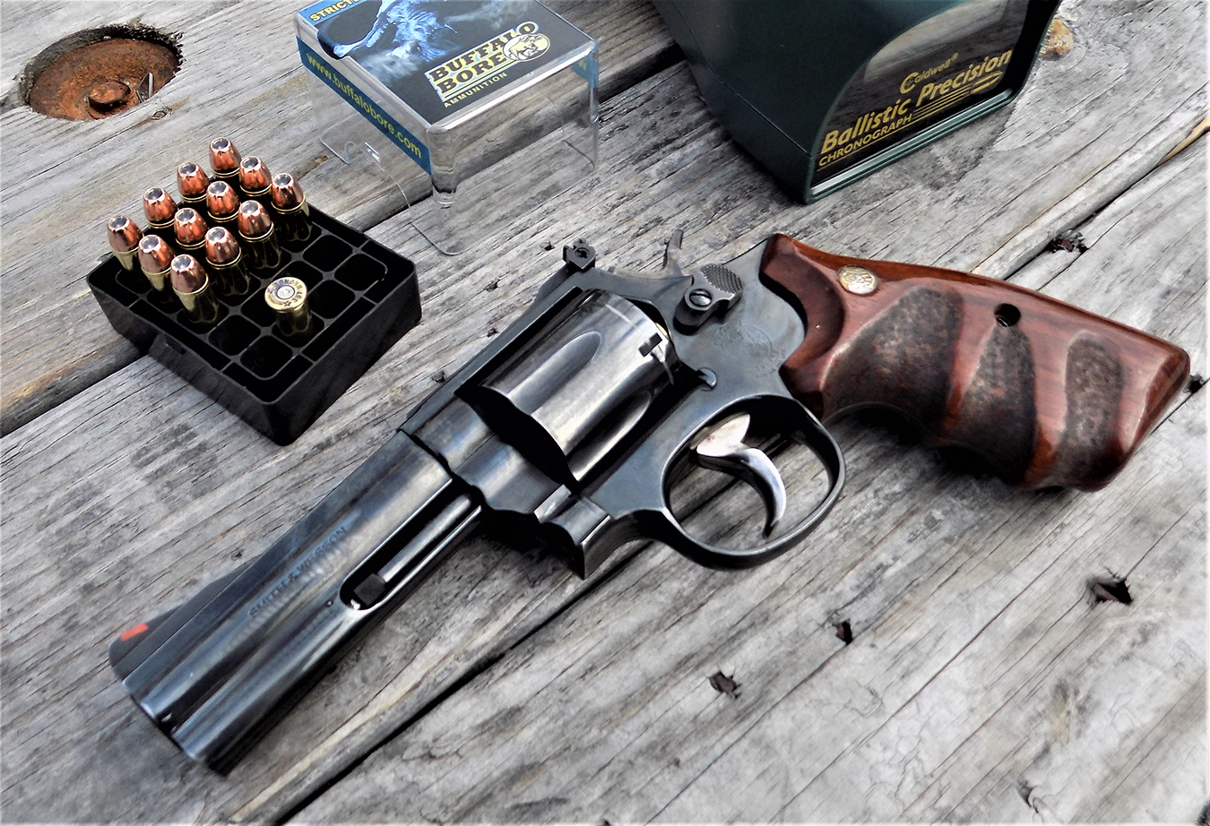 S&W 686 revolver on a wood bench