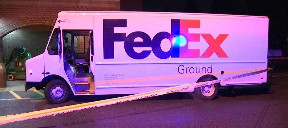 FedEx truck behind crime scene tape after armed good guys in shootout