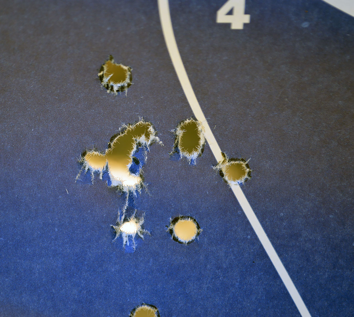 open group of bullet holes from a .380 caliber Beretta handgun