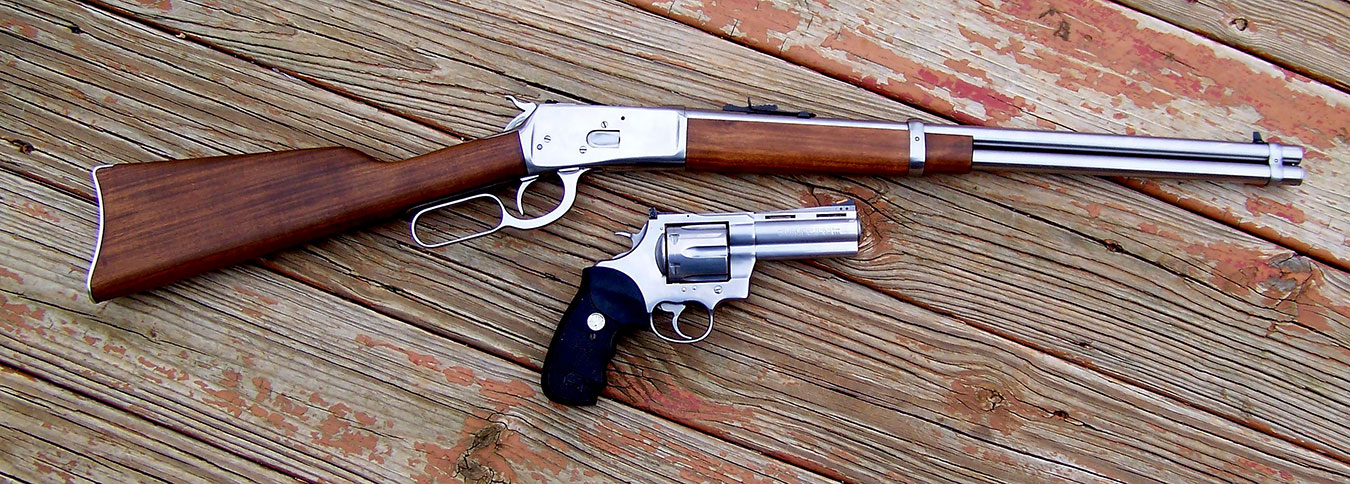 Levr action rifle and revolver both chambered for .45 Colt