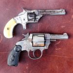 Two early model Smith and Wesson revolvers