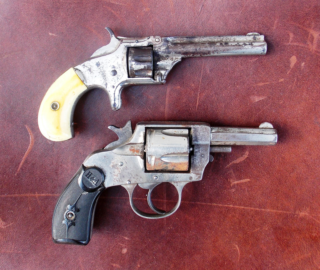 Two early model Smith and Wesson revolvers