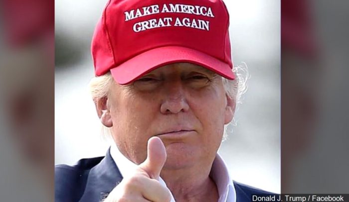 President Trump wearing a red MAGA hat similar to the one armed good guys wear