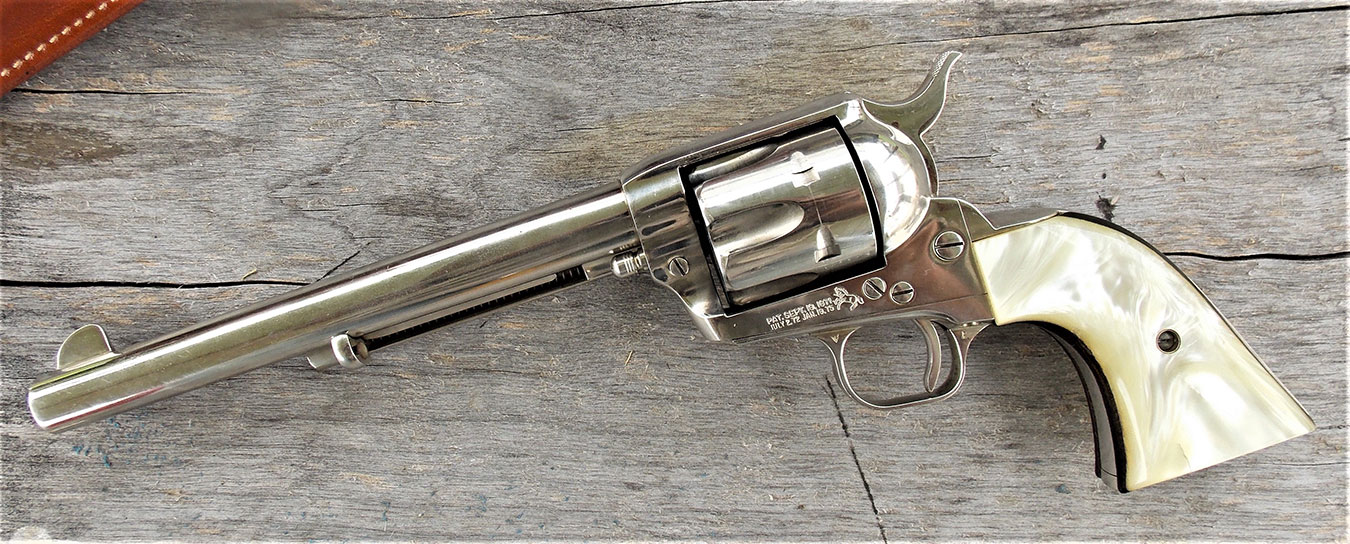 Colt Single Action Army left profile on a wood background