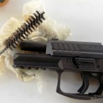 HK VP9 with slide locked back and cleaning supplies