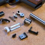 Oversized internal parts of a 1911 pistol before handfitting