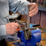 working on a 1911 that is held by a vice